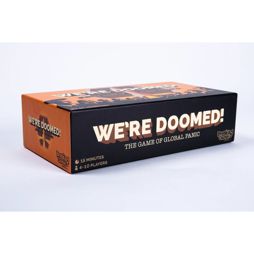 The board game box for 'We're Doomed! The Game of Global Panic' shown on a clean white background. The packaging features a black front face with bold white text and an orange side panel with a distressed cross graphic.