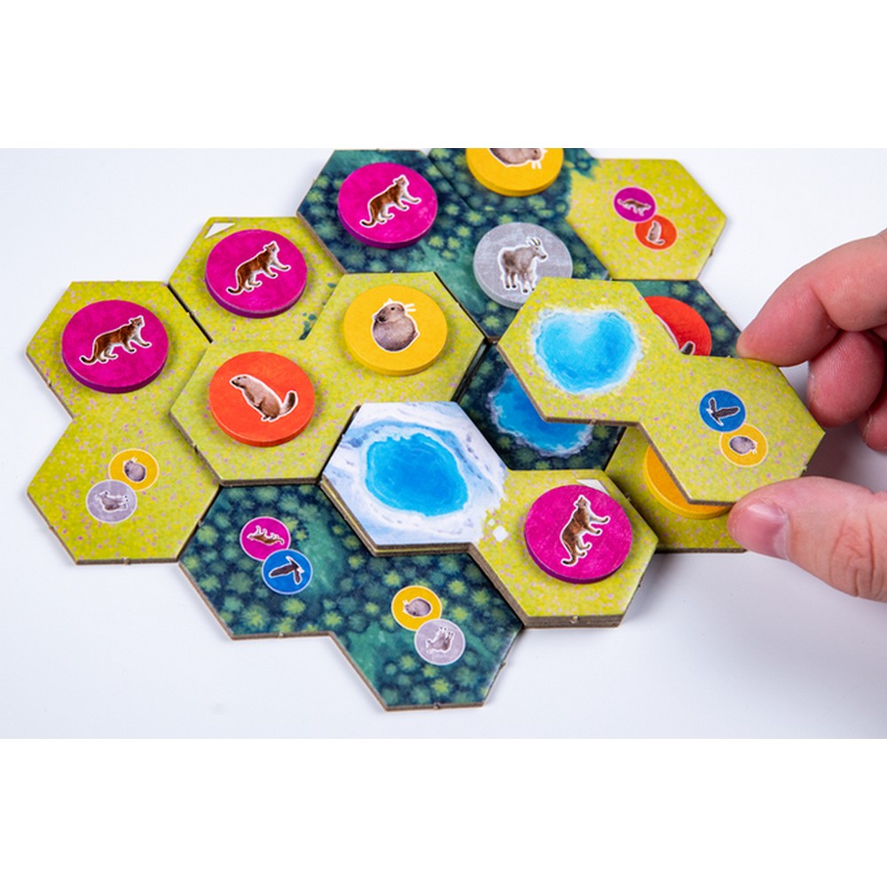 Hexagonal game tiles with animal icons on a white background