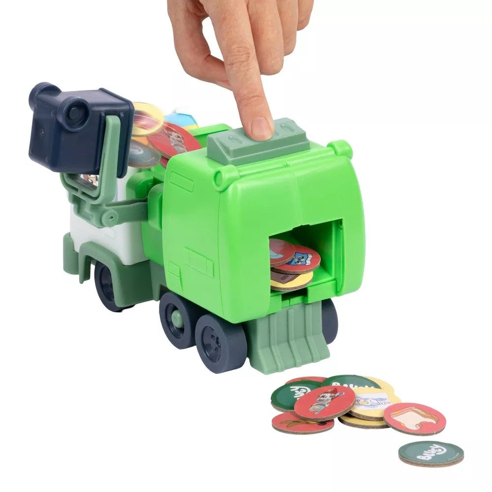 Green toy machine with circular components on a white background