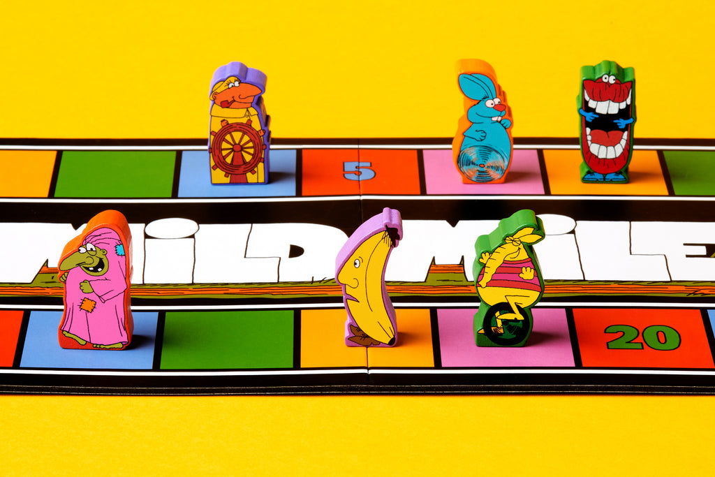 Colorful board game pieces on a 'Wildlife' themed board with a yellow background
