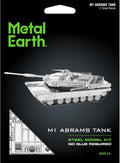 Metal Earth M1 Abrams Tank 2-sheet steel model kit packaging with a black background, green Metal Earth logo, silver tank illustration, and two black tweezers shown below the package.
