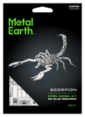 Metal Earth Scorpion steel model kit retail packaging, featuring a black background with a large silver scorpion model, green 'Metal Earth' logo, and white text reading 'Scorpion Steel Model Kit' and 'No Glue Required'.