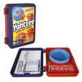 Yahtzee game set with dice cup, dice, and score sheet on a white background