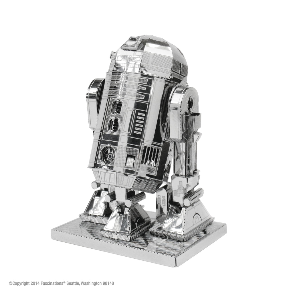 Metal model of R2-D2 from Star Wars on a white background