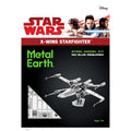 Star Wars X-Wing Starfighter Metal Earth steel model kit packaging, featuring a black background with the Star Wars and Disney logos, green 'Metal Earth' text, and a rendered silver X-wing starfighter model.