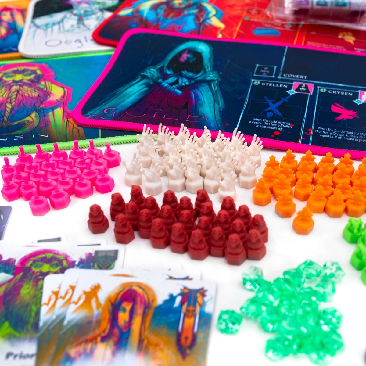Colorful game pieces and cards on a board game surface