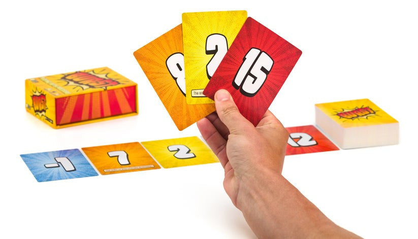 Colorful number cards with a hand holding one of them against a white background