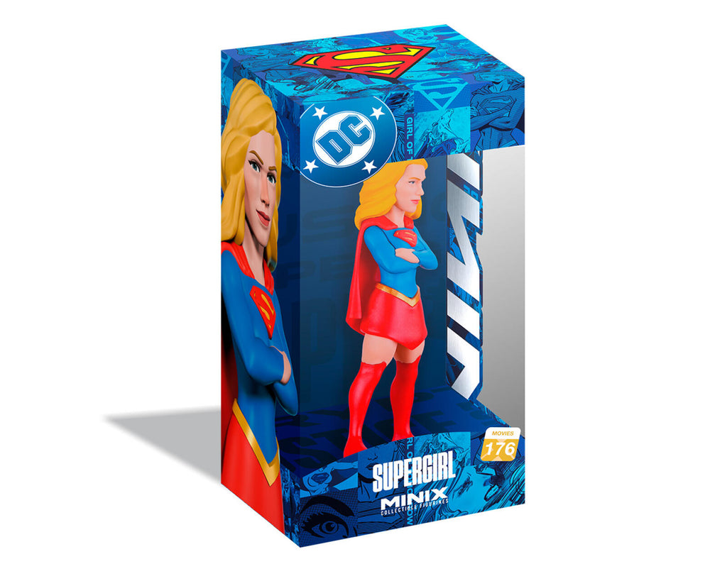 Supergirl Minx toy figure in its original blue and red DC Comics packaging, featuring a clear window displaying the blonde superhero figure.