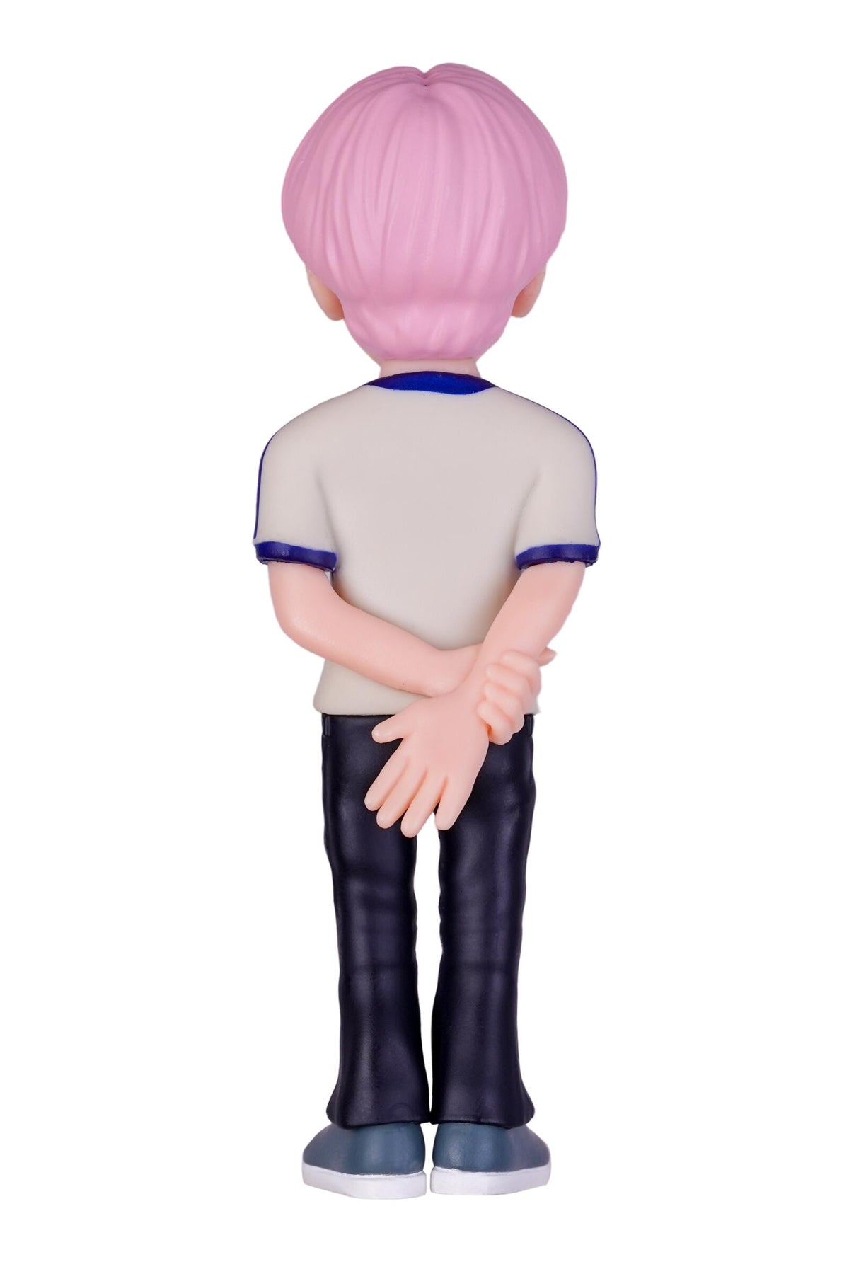 A stylized anime figurine shown from the back, featuring short pink hair, a beige t-shirt with blue trim, dark blue pants, and blue shoes, set against a plain white background.