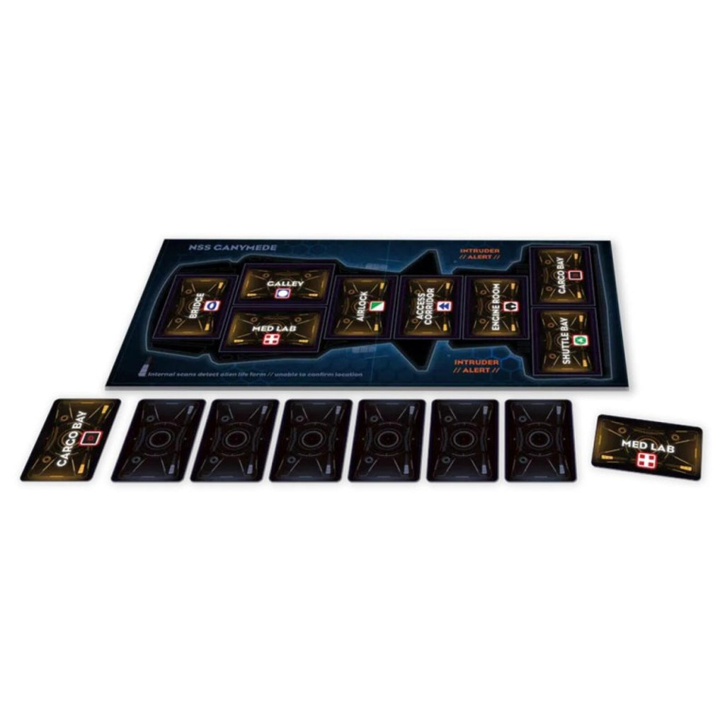 space ship board game components on a white background, including a dark blue game board, multiple black cards, and a small Med Lab token card.