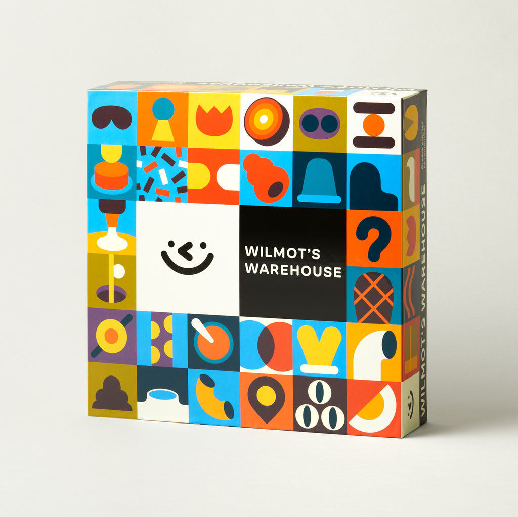 Colorful box with geometric patterns and 'Wilmot's Warehouse' branding on a light gray background